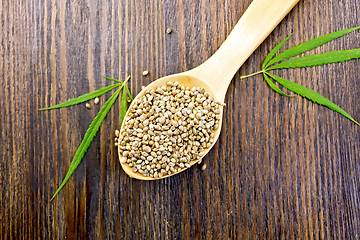 Image showing Hemp grain in spoon on board