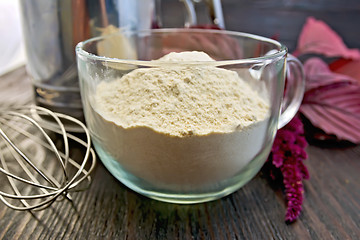 Image showing Flour amaranth in glass cup with mixer on board