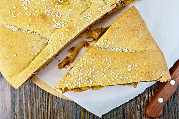 Image showing Pie with cabbage and sesame on parchment top