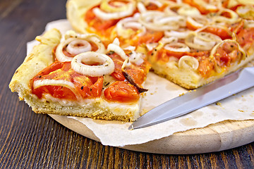 Image showing Pie with onions and tomatoes on parchment