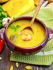 Image showing Soup-puree pumpkin with prawns and mushrooms on board