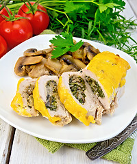 Image showing Roll chicken with champignons and cheese on board