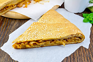 Image showing Pie with cabbage and sesame on parchment