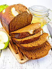 Image showing Bread apple with honey on light board