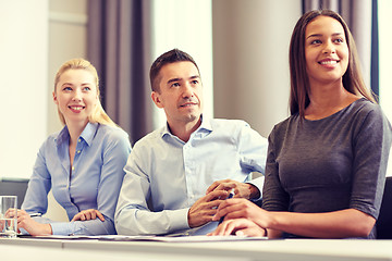 Image showing group of smiling businesspeople meeting in office