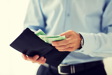 Image showing close up of businessman hands holding money