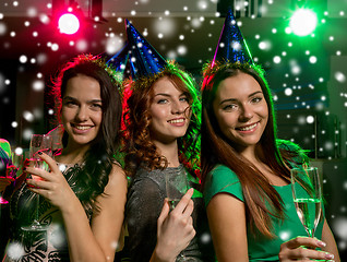 Image showing smiling friends with glasses of champagne in club