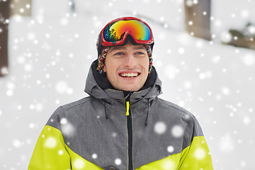 Image showing happy young man in ski goggles outdoors