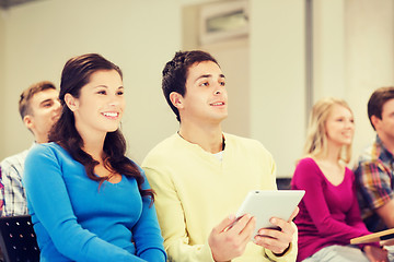 Image showing group of smiling students with tablet pc