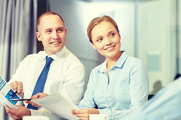 Image showing business people with papers meeting in office