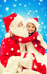 Image showing smiling little girl with santa claus