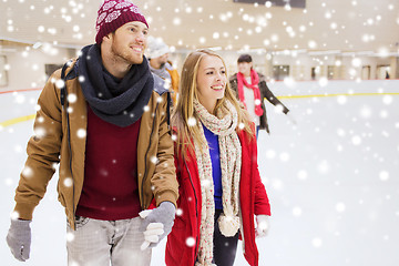 Image showing happy friends on skating rink