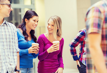 Image showing group of smiling students with paper coffee cups