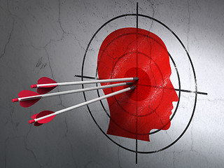 Image showing Studying concept: arrows in Head target on wall background