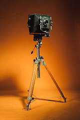 Image showing Vintage retro camera on a tripod