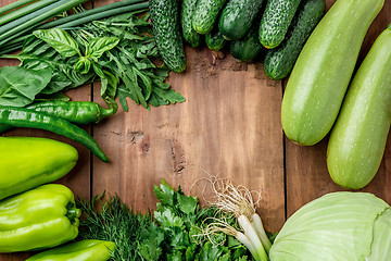 Image showing The green vegetables on wooden table