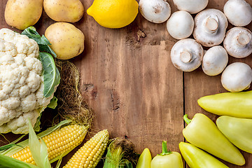 Image showing The multicolored vegetables on wooden table