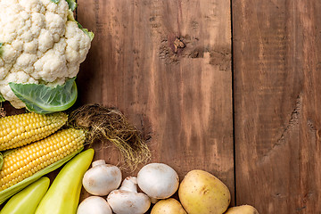 Image showing The multicolored vegetables on wooden table