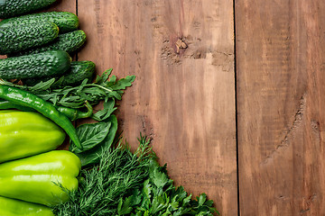Image showing The green vegetables on wooden table