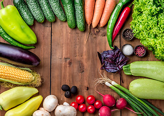 Image showing The multicolored vegetables on wooden table