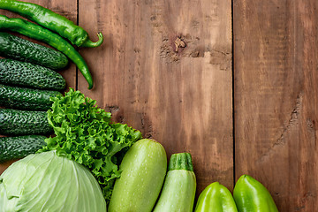 Image showing The green vegetables on wooden table