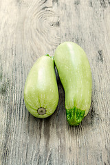 Image showing The two zucchini on wooden background