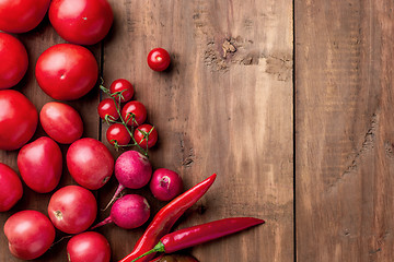 Image showing The red vegetables on wooden table