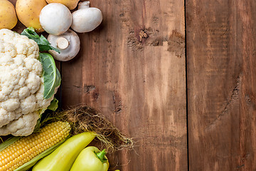 Image showing The multicolored vegetables on wooden table