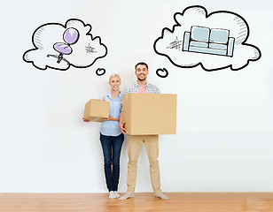 Image showing couple with cardboard boxes moving to new home