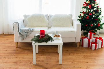 Image showing sofa, table and christmas tree with gifts at home