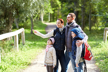 Image showing happy family with backpacks hiking