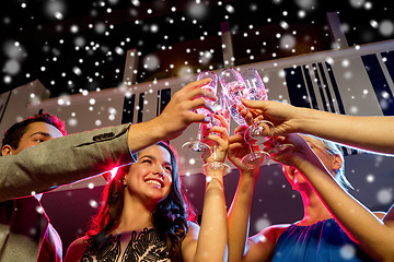 Image showing smiling friends with glasses of champagne in club