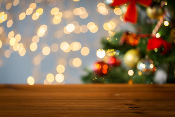 Image showing empty wooden surface over christmas tree lights