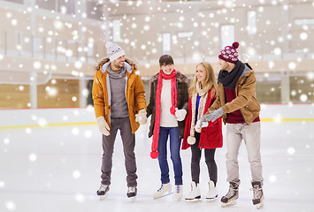 Image showing happy friends on skating rink