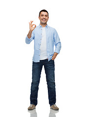 Image showing smiling man showing ok hand sign