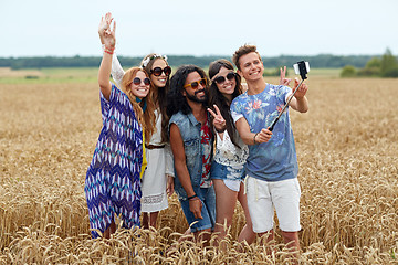 Image showing hippie friends with smartphone on selfie stick