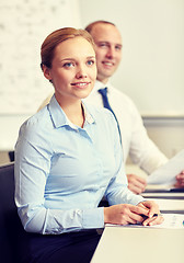 Image showing smiling business people meeting in office