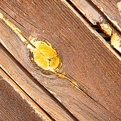 Image showing home texture of a brown antique wooden old door in italy   europ