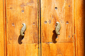 Image showing stripped paint  door    in   and traditional  texture nail