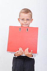 Image showing The boy with folders 