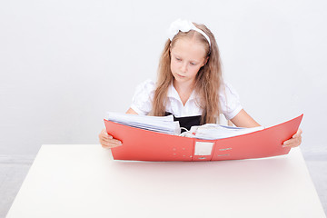 Image showing Schoolgirl with folders 