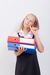 Image showing Schoolgirl with folders 