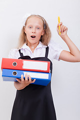 Image showing Schoolgirl with folders 