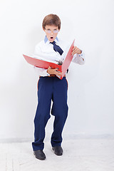 Image showing The boy with folders 