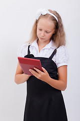 Image showing Portrait of teen girl with calculator on white background