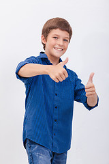 Image showing Portrait of happy boy showing thumbs up gesture