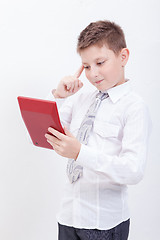 Image showing Portrait of teen boy with calculator on white background