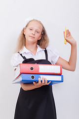 Image showing Schoolgirl with folders 