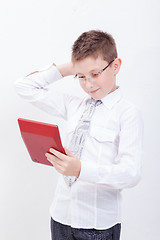 Image showing Portrait of teen boy with calculator on white background