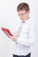 Image showing Portrait of teen boy with calculator on white background